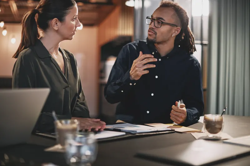Two colleagues in a one-on-one conversation