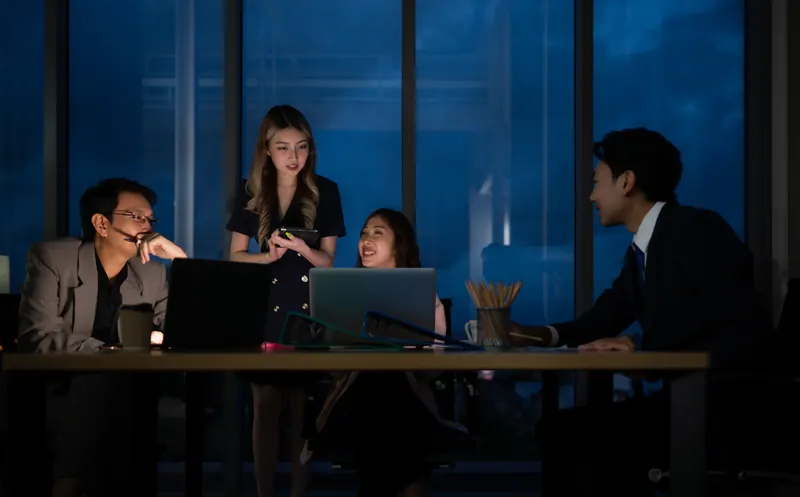 A leadership team reviewing numbers late in the office